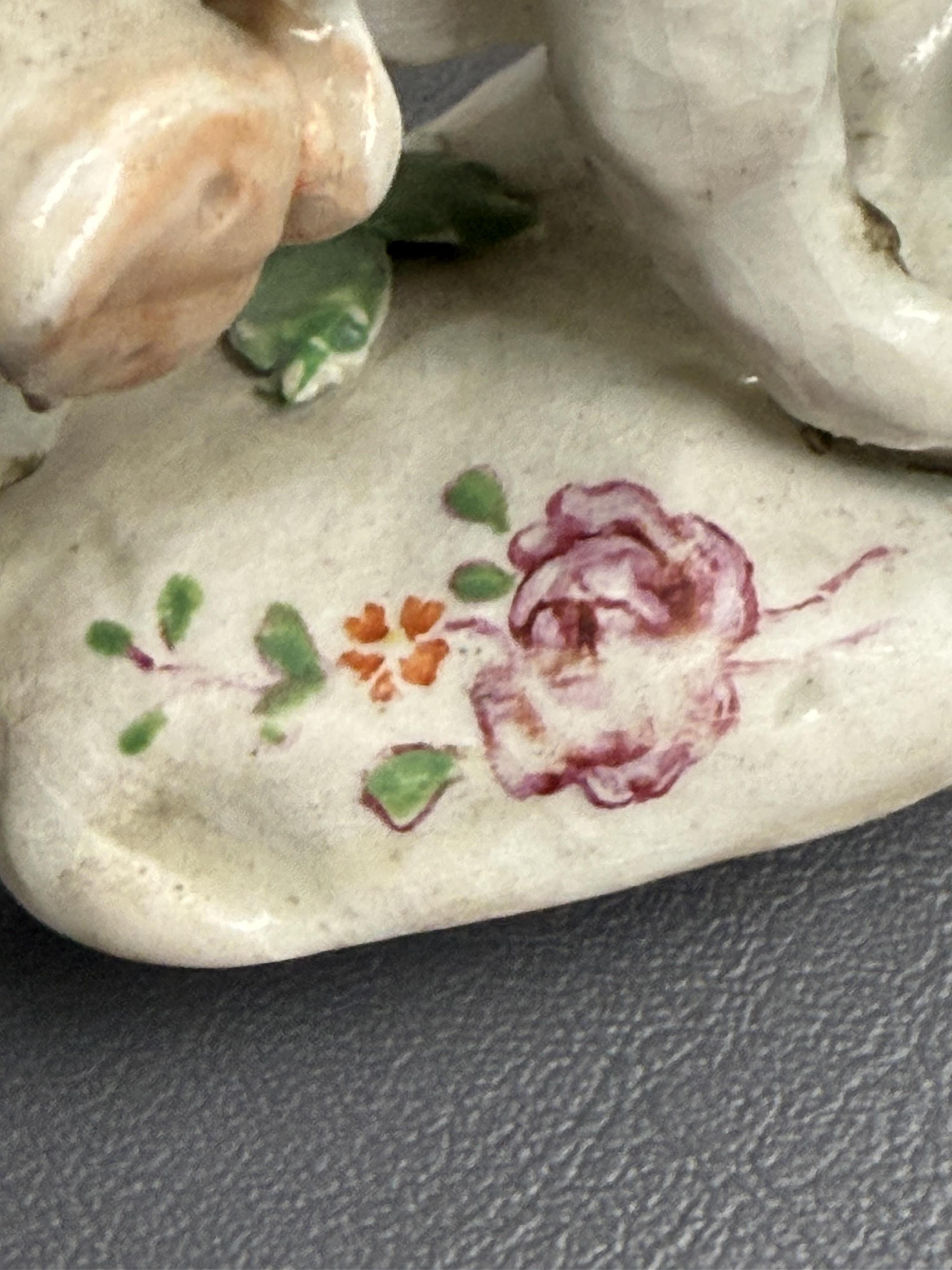 A pair of early Derby porcelain models of wild boars, c.1752-55